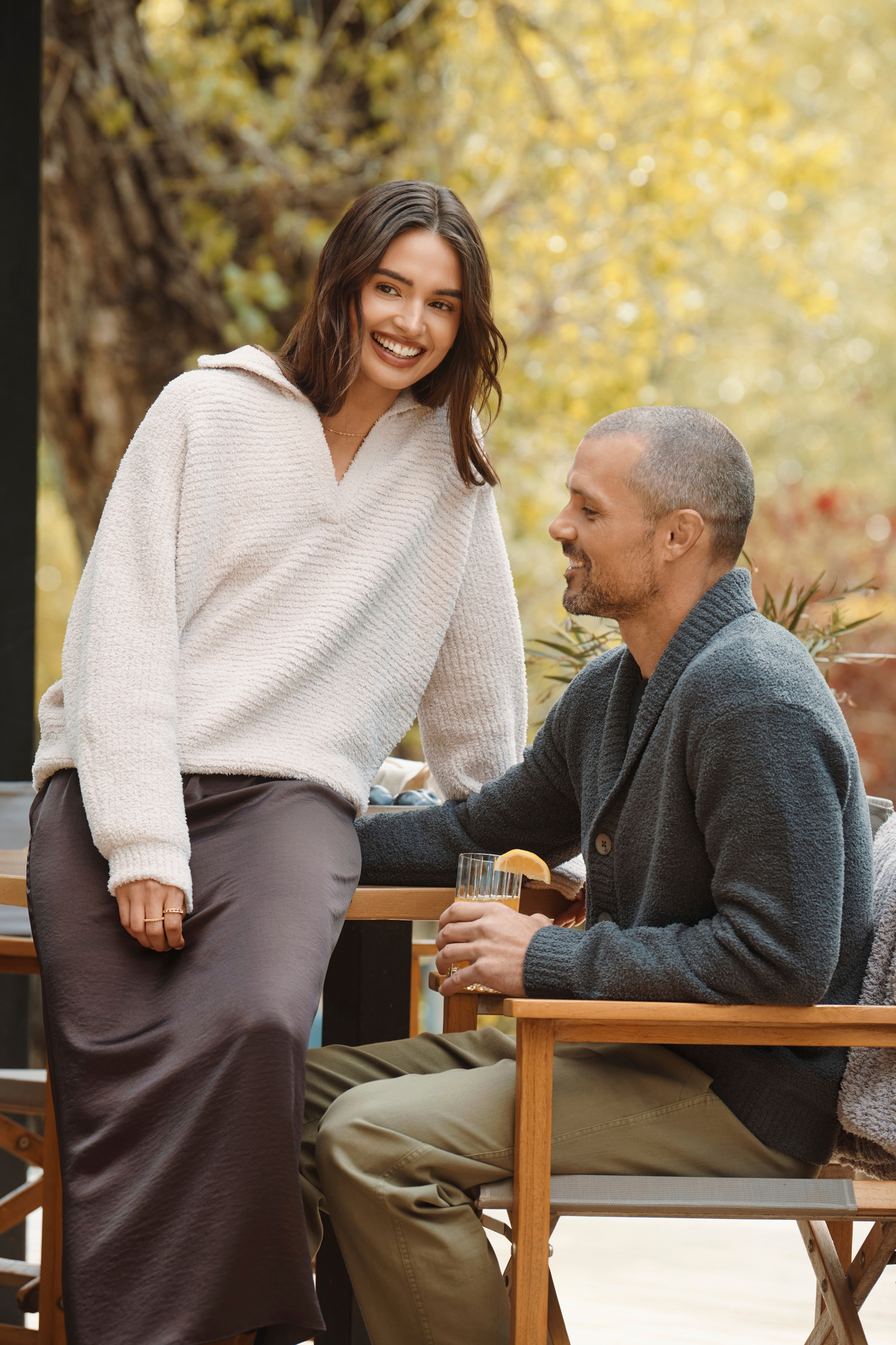 A woman and man enjoying brunch wearing barefoot dreams. 