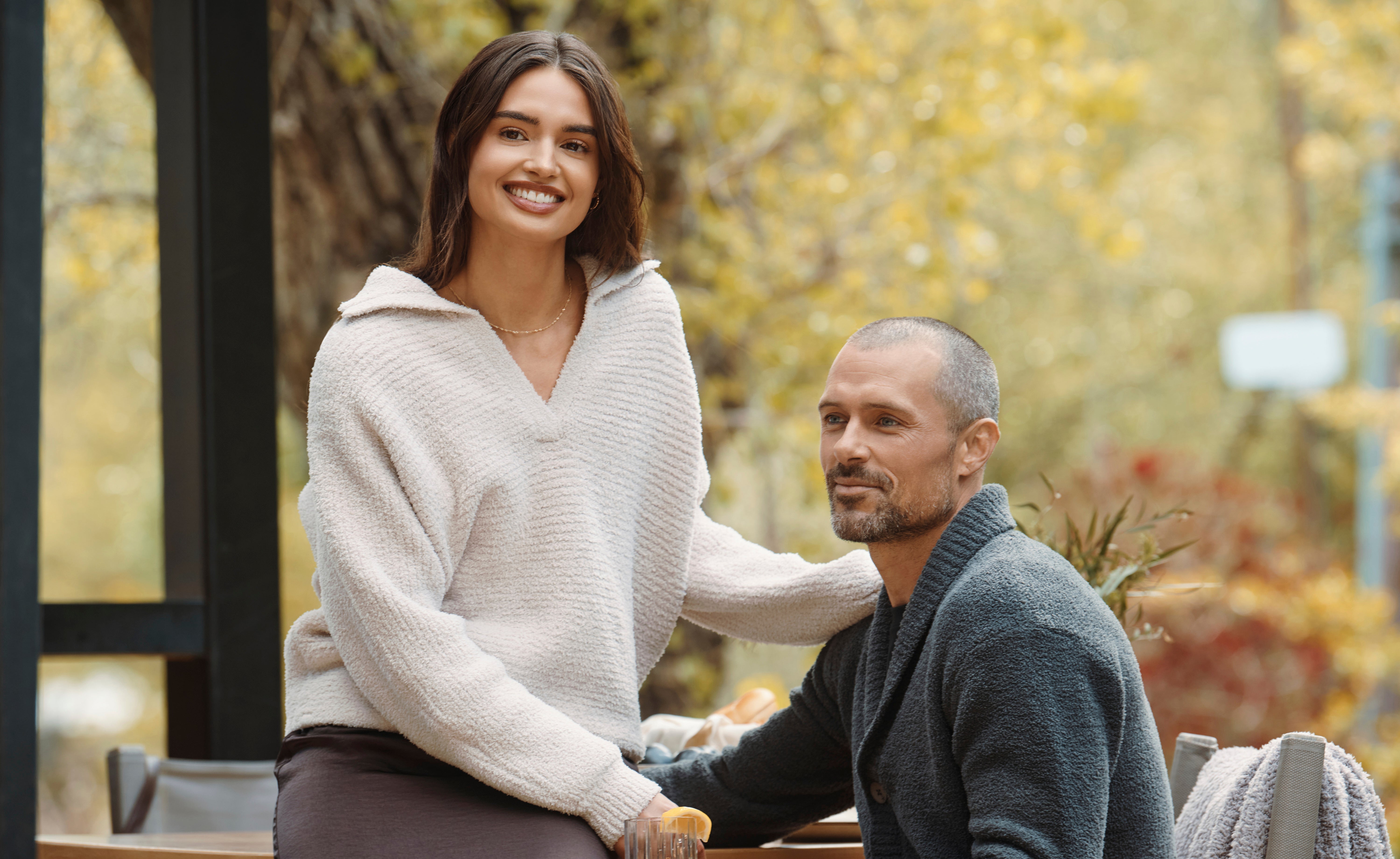 Woman and man wearing Barefoot Dreams sweaters